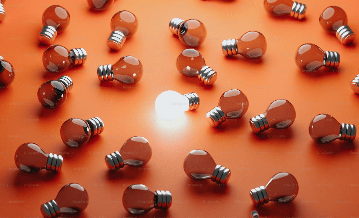 A group of light bulbs sitting on top of an orange surface